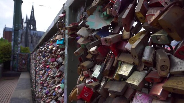 Bridge railings, densely hung with love locks. Millions of locks hang on the Hohenzollern Bridge in Cologne, Germany