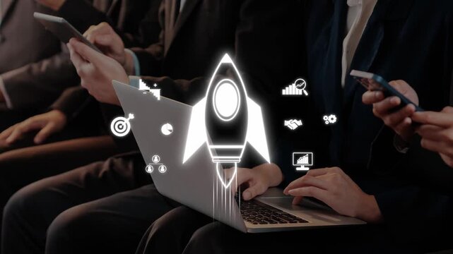 A group of business professionals engaged in their devices while brainstorming innovative ideas and strategies, highlighting the importance of technology in the modern workplace. Raster