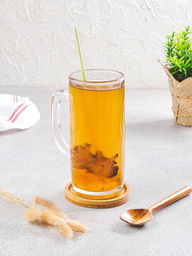 Hot drink Golden Ginger with  Straw &mdash; Minimalist Food and drink Photography
