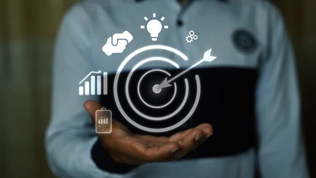 Person holding holographic digital target and arrow concept, A man holding a glowing target icon with arrow and digital symbols showing business goals focus success strategy