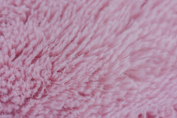 Fototapeta premium Close up view of soft pink shaggy textile surface texture