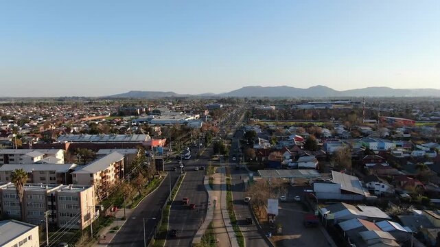 Aerial panoramic view of Talca cityscape and main avenue traffic with mountains in Chile