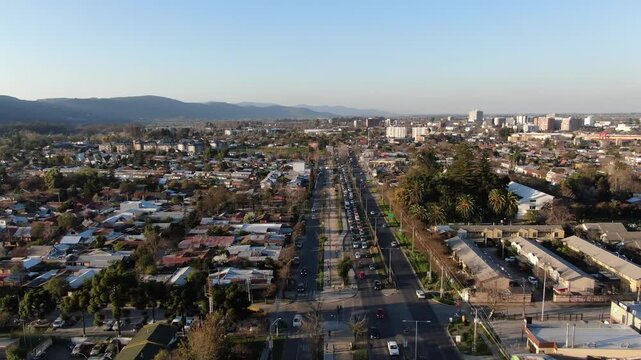 Aerial panoramic view of Talca cityscape and main avenue traffic with mountains in Chile