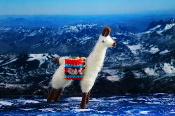 Naklejka premium Llama or alpaca handicrafts in a mountain landscape
