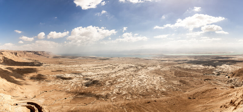 View  from walls of the ruins of the Masada fortress of an adjacent plain and the Dead Sea in the southern Israel near Arad