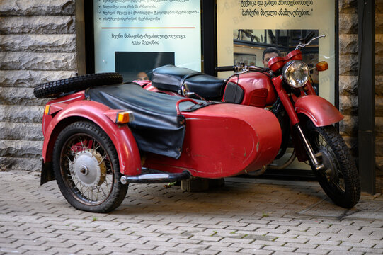 June 11, 2026, Tbilisi, Georgia Red motorcycle with sidecar likely Ural or Dnepr models successor of German BMW R71