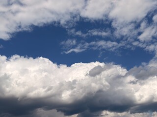 Fototapeta premium Beautiful fluffy white clouds background, sky texture for replacement or graphic design