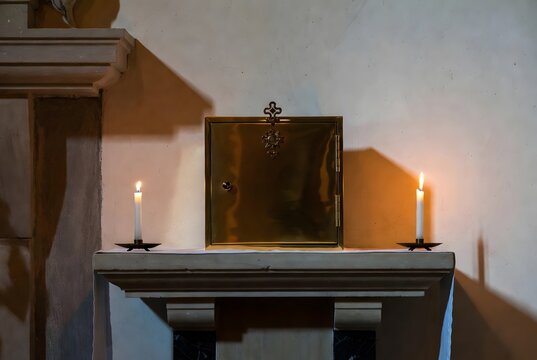 a solemn healing scene focused on a small golden tabernacle door glowing quietly as a symbol of comfort and presence