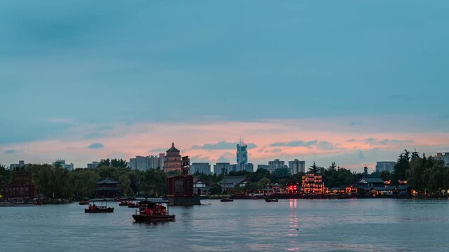 Evening Lake View of Tang Paradise with Traditional Boats in Xi'an China in Tang Paradise, Xi an, China