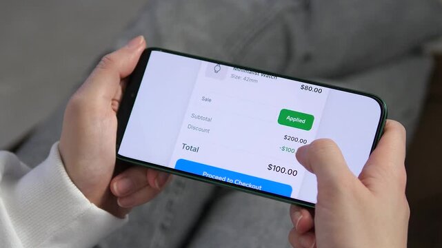 a shopper completing a purchase. The cart applies a 100 dollars discount, reduces the total, and displays a success screen. Great for showcasing e-commerce conversions, retail tech, and mobile