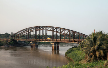 Fototapeta premium The historic German Bridge spanning the Sanaga River in Edea, Cameroon, built during the German colonial period