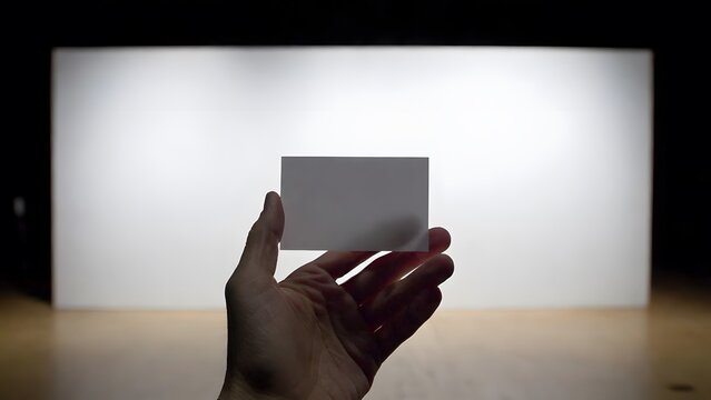 Person Holding Blank Note Card in Hand for Marketing Message, Advertising and Promotional Mockup. High-quality professional photograph featuring a person holding a blank white note card, ticket 