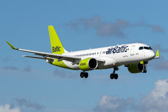 Vijfhuizen, Netherlands - June 5, 2026: Latvian airBaltic Airbus A220-300 with registration YL-ABQ on short final for runway 18R (Polderbaan) of Amsterdam Airport Schiphol