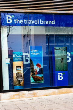 Barcelona, Spain-June 12, 2026. Blue travel agency storefront window display