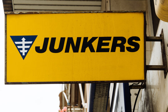 Barcelona, Spain-June 12, 2026. Yellow junkers shop sign on building facade