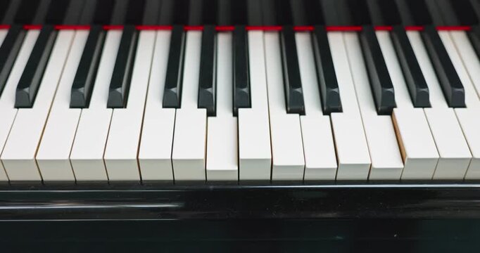 Piano playing music by itself closeup