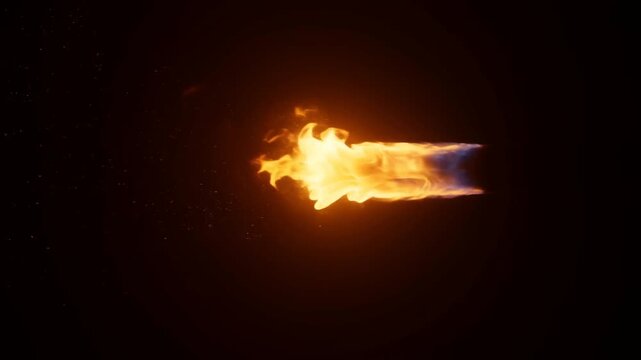 Slow motion tracking of flaming projectile streaking horizontally across dark void with glowing orange and blue fire trail