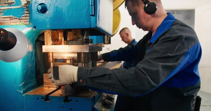Sheet metal processing workflow with multiple press machines producing formed industrial parts