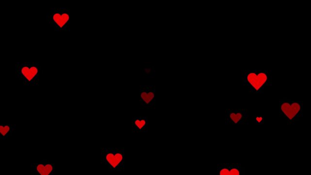 Red hearts falling down against a dark black background. love heart 4k video,pink and red hearts gracefully falling on a alpha channel. Social media love emoji particles moving. 