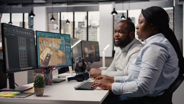 Team of designers developing digital 3D architecture model with virtual assets and software, architect and worker uses interface to render apartment layout and prepare floor plan blueprints.
