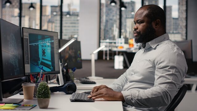 Black worker creating fantasy video game with AI neural networks systems, using advanced development software, Engineer working with programming tools.