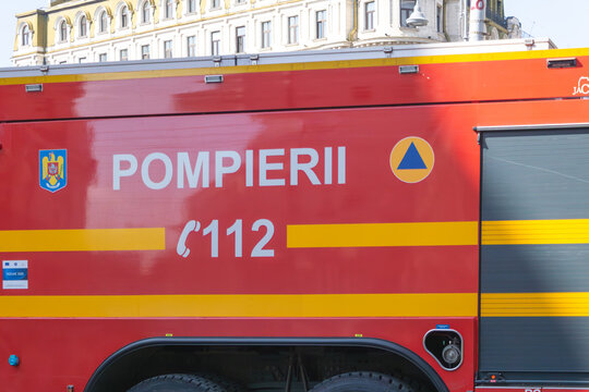 Close-up view of a Romanian fire truck displaying the emergency number 112 and firefighter markings Bucuresti, Romania - March 15 2026