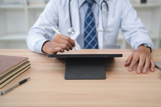 Doctor Using Digital Tablet for Patient Records and Consultations