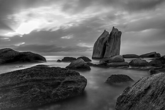Black and white long exposure of Sailing Rocks (Yelken Kayalıkları) in Fo&ccedil;a, İzmir, Turkey.