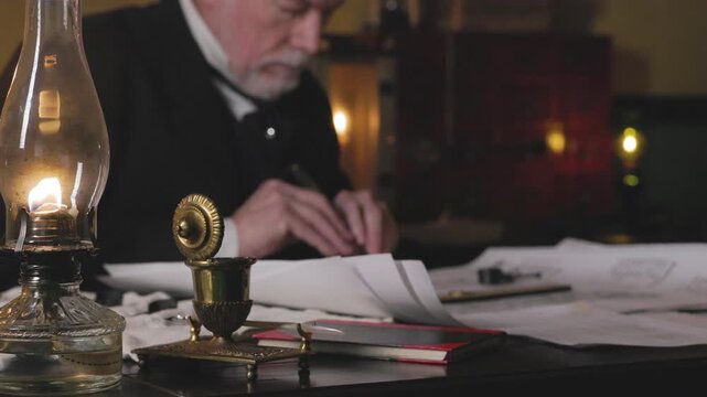 Focus on oil lamp of 1800s man using a caliper