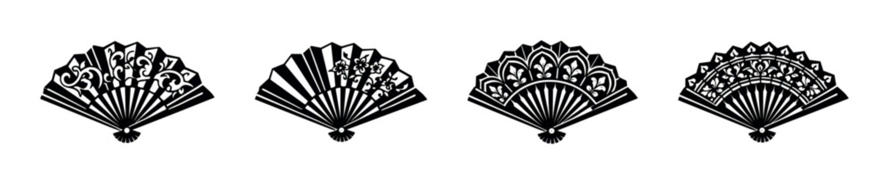 Collection of four decorative folding fans with intricate black patterns