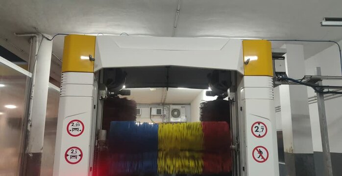 Automatic car wash brushes rotating and cleaning