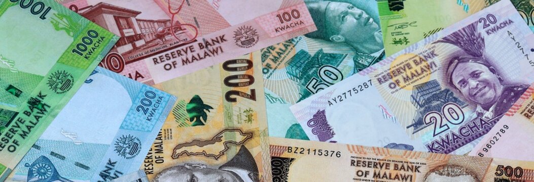 Malawian kwacha money banknotes bunch on table. Malawi bills of MWK currency