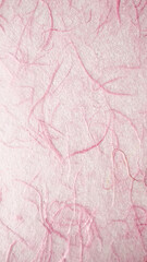 Fototapeta premium Soft pink handmade paper texture with visible fibers