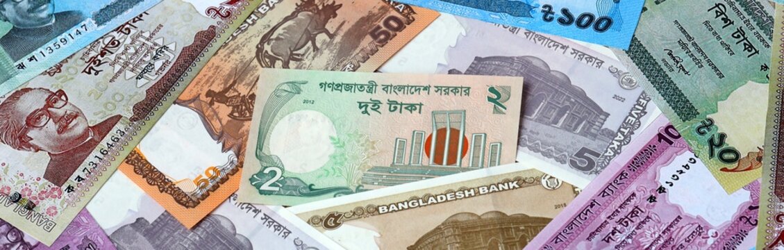 Bangladeshi taka money bills in pile. Big amount of Bangladesh BDT currency cash close up