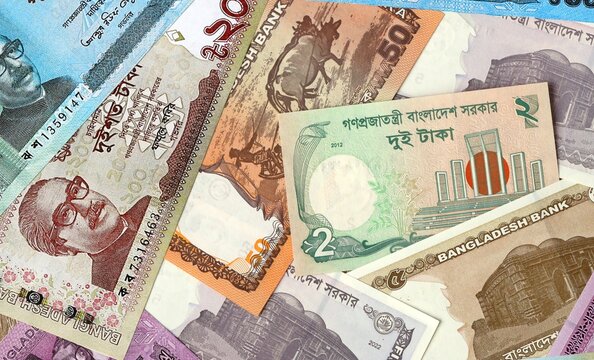 Bangladeshi taka money bills in pile. Big amount of Bangladesh BDT currency cash close up