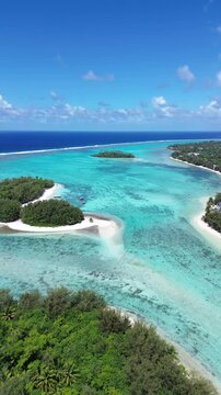 A drone view of Rarotonga,Muri Beach. the capital of the Cook Islands.Beautiful ocean view of coastline with clear water and houses in the sun