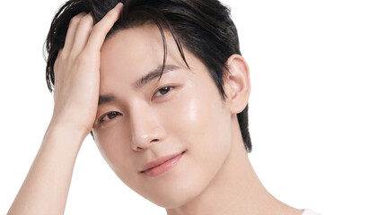 Fototapeta premium Young Asian idol adjusting his hair with flawless skin and soft confident expression, isolated on white background, premium beauty portrait.