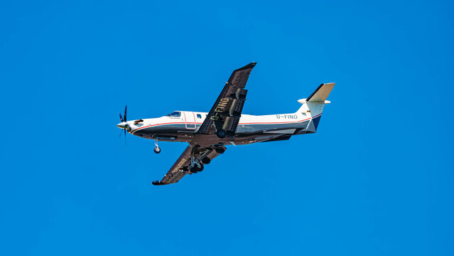 D-FINO - Pilatus PC-12 NGX private airplane approaching landing on a sunny spring day at Munich airport, MUC, Freising, Bavaria, Germany