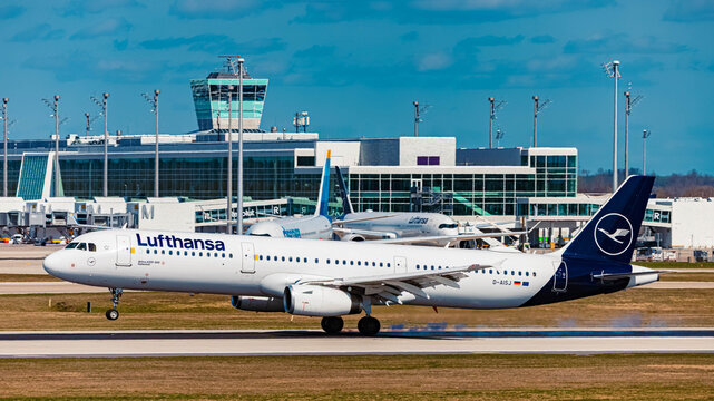 D-AISJ Lufthansa Airbus A321 passenger jet airplane touchdown with smoking tires on a sunny spring day at Munich airport, MUC, Freising, Bavaria, Germany