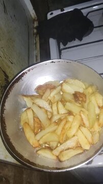 Deep Frying Potato Slices in Hot Oil