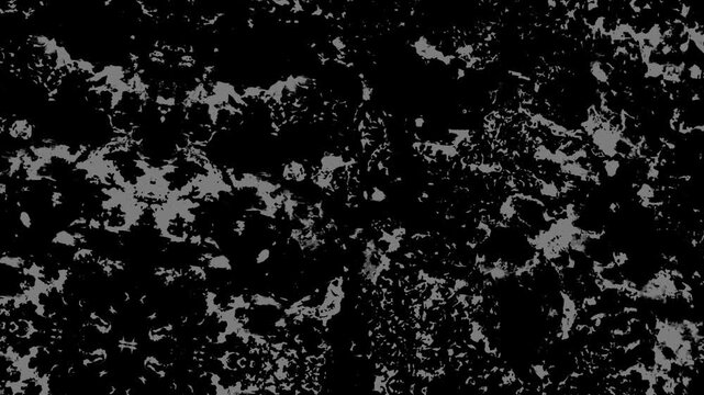 Abstract black and white fractured texture with intricate patterns, rough surfaces, and strong contrast. Grunge texture background animation.