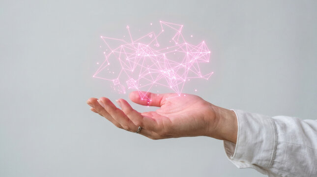 Hand holding pink smoke particles.