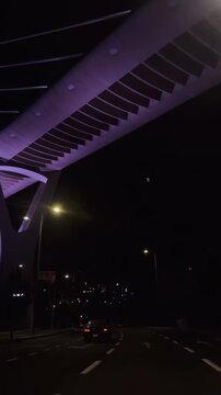traffic in night the Abdoun Bridge in Amman, Jordan, known for its distinctive Y-shaped pillars and cable-stayed design.