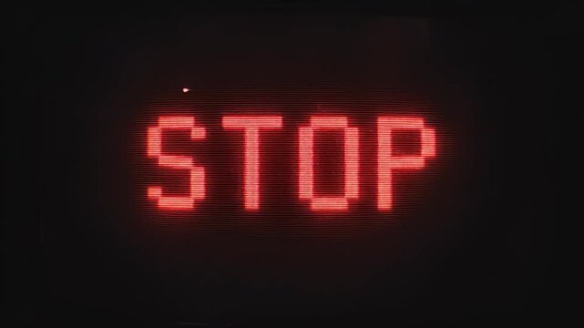 Red pixelated stop text with heavy analog glitch and vhs noise