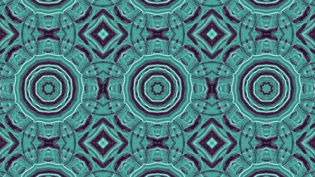 Intricate geometric pattern in teal and dark blue, featuring concentric circles and shapes.