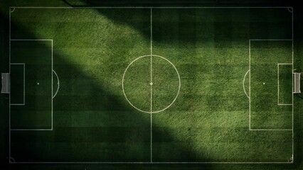 Obraz premium Aerial Top Down View of Empty Soccer Field with Dramatic Shadow and Detailed Grass Texture