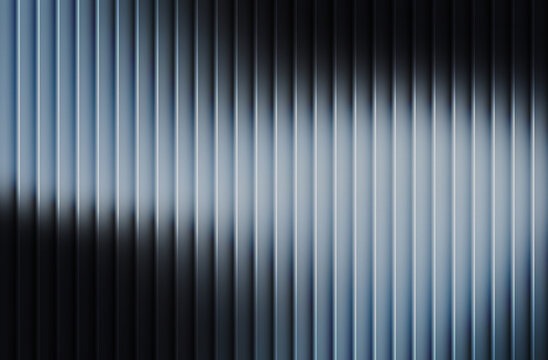 Vertical ribbed metallic surface texture with dramatic light and shadow creating a futuristic abstract background