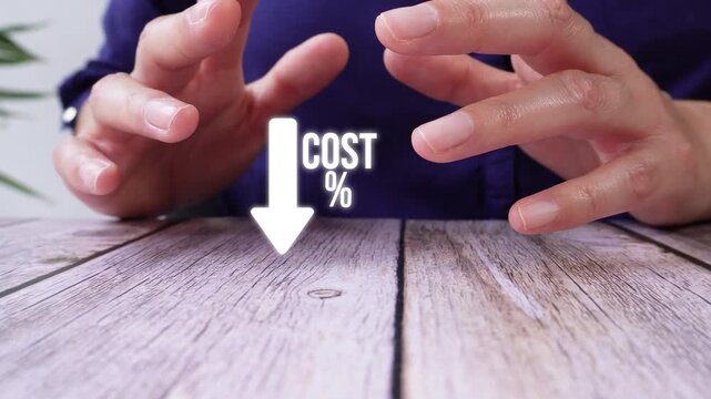 Close-up of a pair of hands on a table, shielding an animated downward-pointing arrow next to "% cost". Ideal for promotions, discounts, or budget presentations.