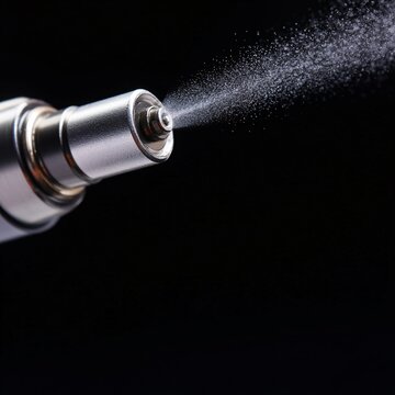 Fuel injector spraying gasoline inside engine macro shot automotive technology dark background close-up