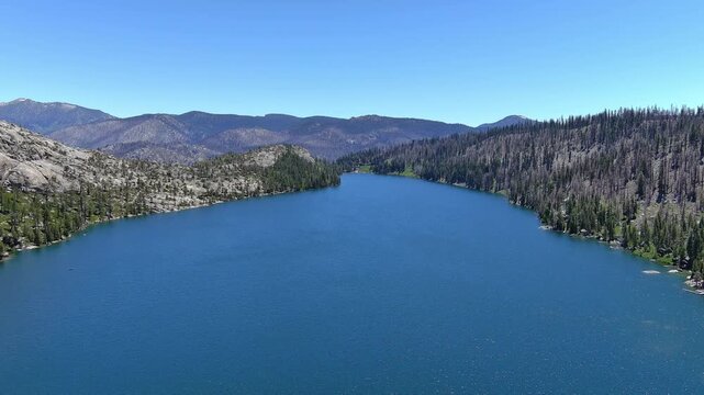Echo Lakes and summit with desolation wilderness taken from a aerial point of view. The burn scars from the 2022 Caldor fire are evident and the forest hasn&rsquo;t recovered yet. Views also of  Lake Tahoe.